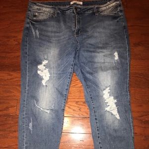 Distressed denim jeans